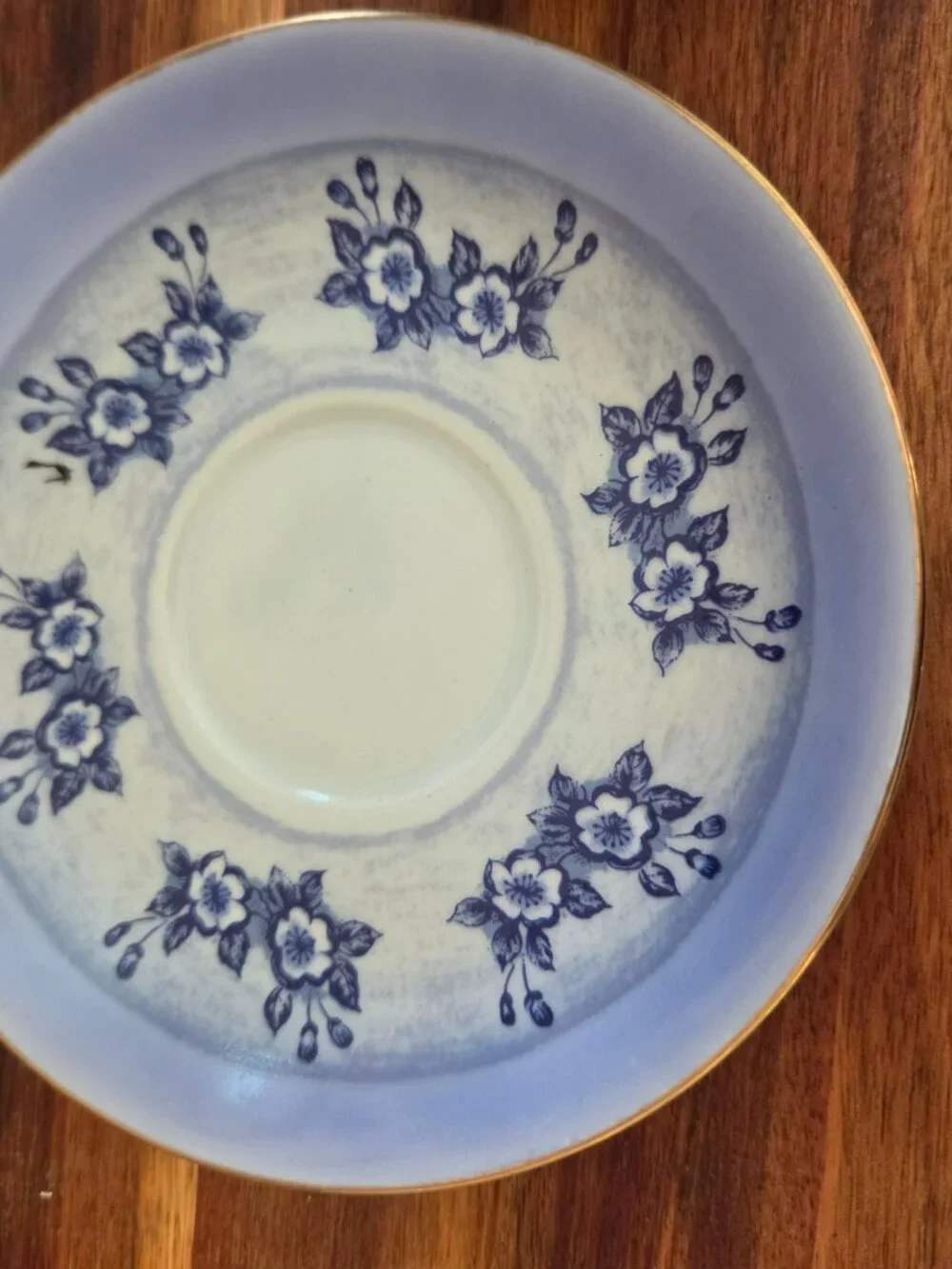 vintage teacup with praying hands blue and white toile pattern